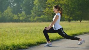 healthy young woman stretching before Fitness and Exercise; adult; athlete; athletic; beautiful; beauty; body; caucasian; diet; energy; exercise; female; fit; fitness; fresh; girl; happy; health; healthy; jogging; leg; leisure; lifestyle; model; morning; muscle; nature; outdoor; outside; park; people; person; recreation; relax; relaxation; run; runner; shape; slim; smile; sport; stretch; summer; training; vitality; woman; workout; young